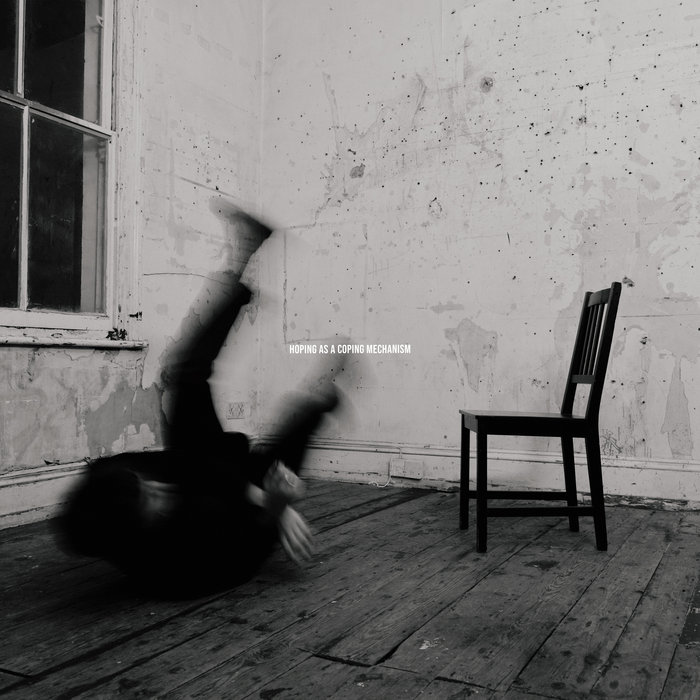 Hoping as a Coping Mechanism album cover: a blurred figure falling beside a chair